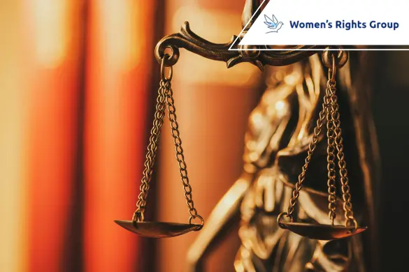 Close-up of brass scales of justice