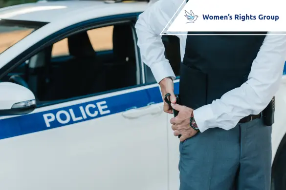 Police officer near patrol car